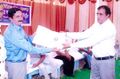 Laxman Burdak donating Jat History Books to Sugna Ram Katewa at Gramin Kisan Chhatrawas Ratangarh on 19.10.2014